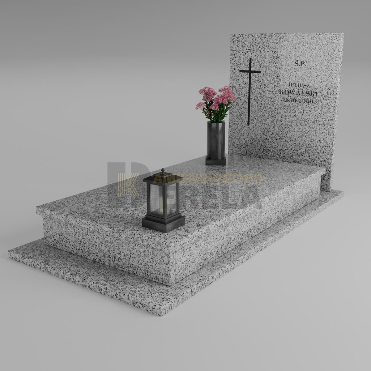 ciemny pomnik granitowy z skosu