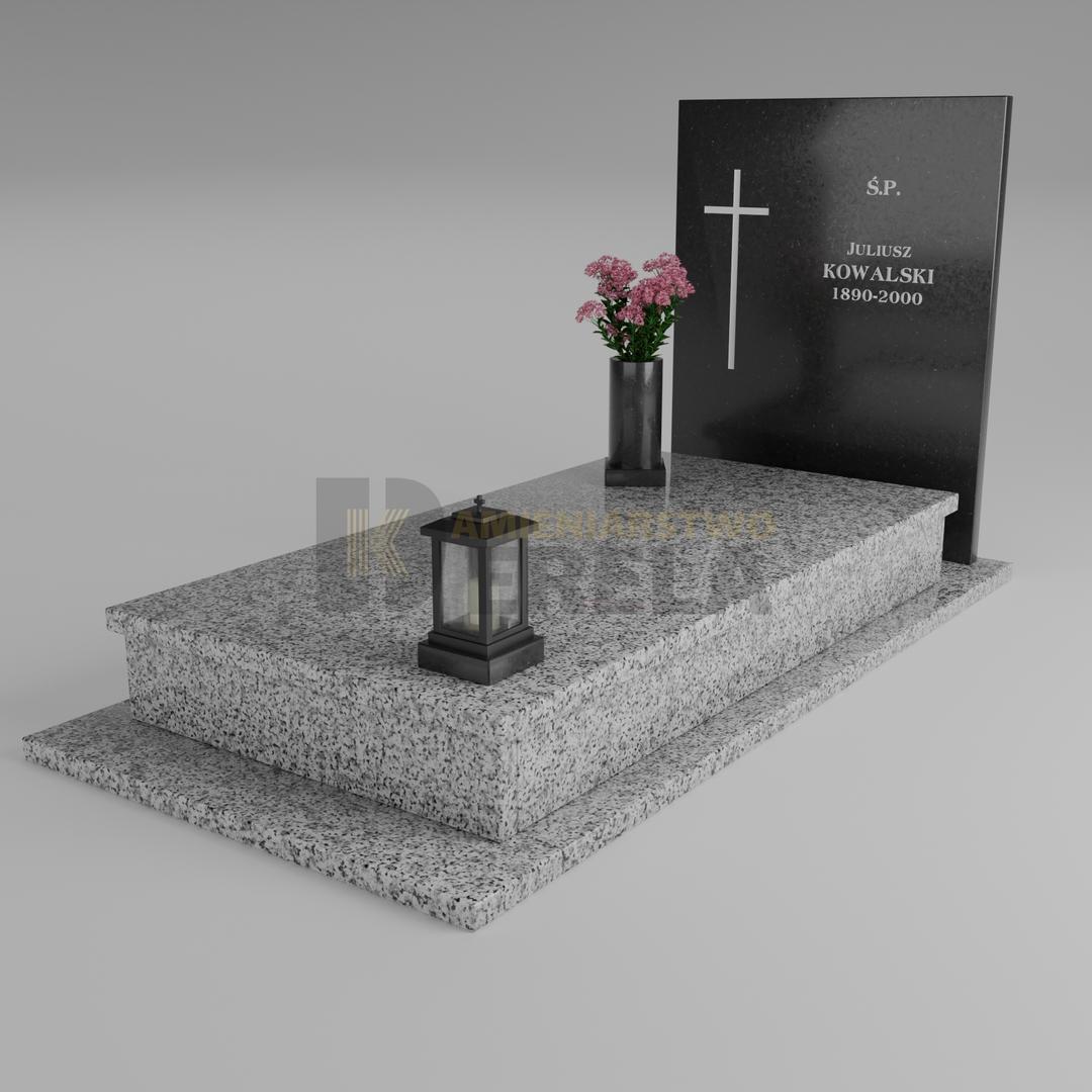 ciemny pomnik granitowy z skosu