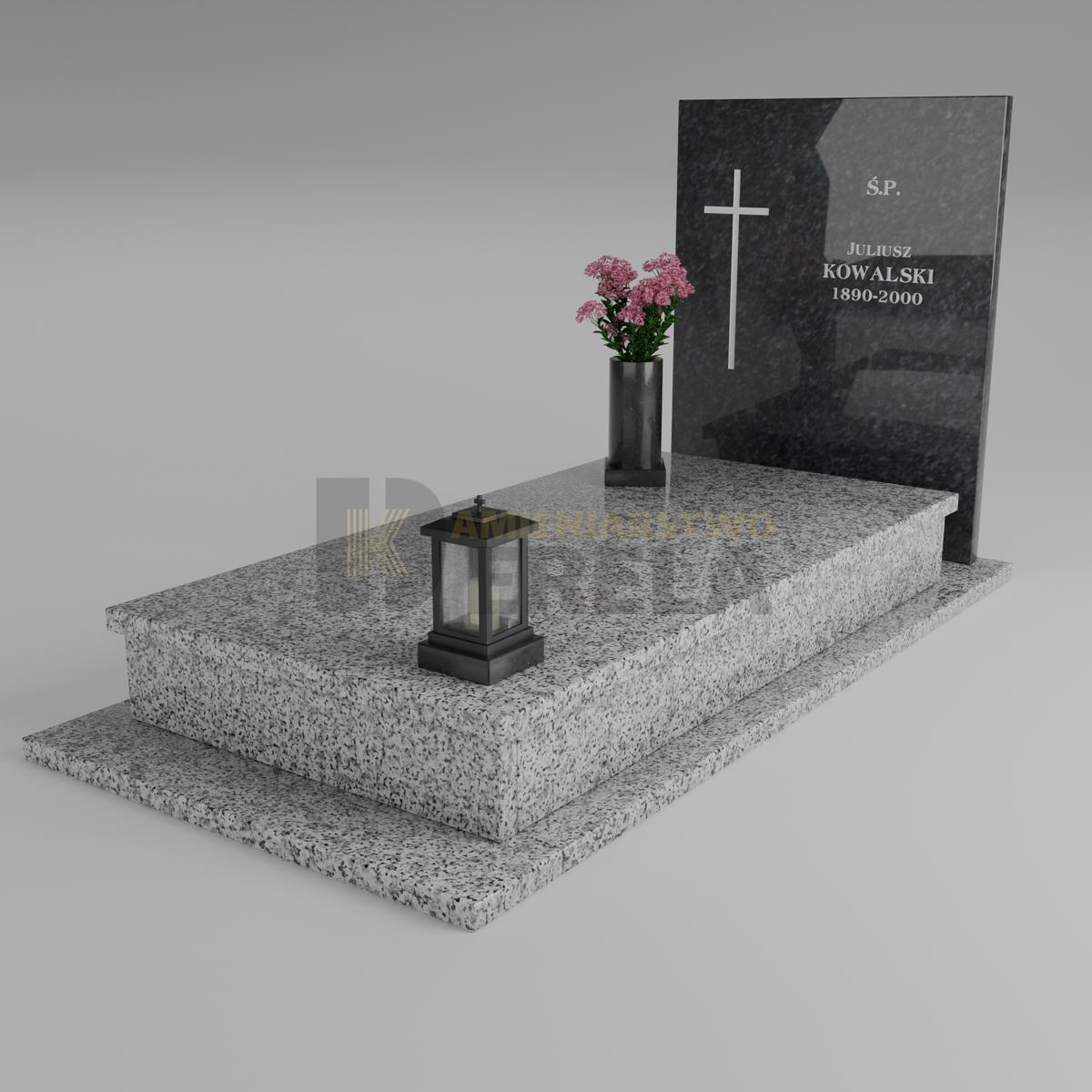 ciemny pomnik granitowy z skosu